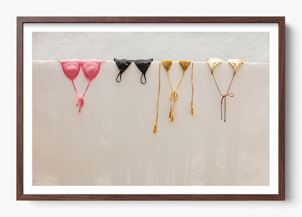 Bikini Hangs in a Heritage Walnut frame