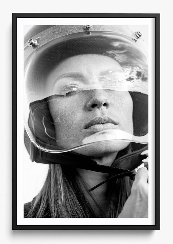 She Can. She Must. in a Black frame