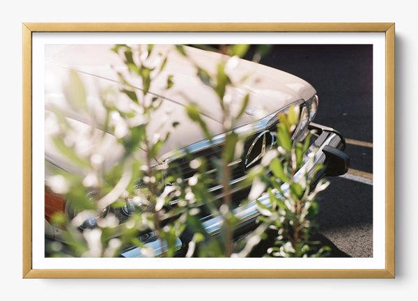 The Benz in a Gold frame